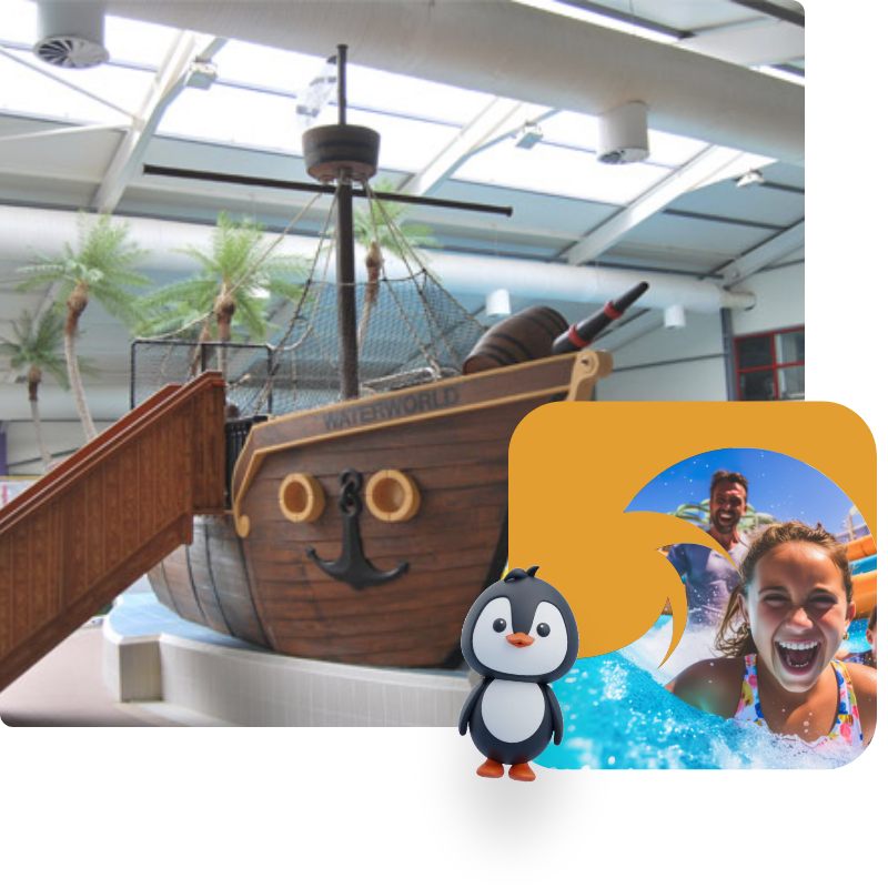 An indoor water park features a pirate ship with a slide. Next to it is an image of joyful people splashing in a pool, along with a cartoon penguin mascot. Palm trees are visible in the background under a glass ceiling.